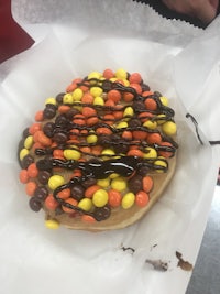 a waffle with sprinkles and m&m's on it