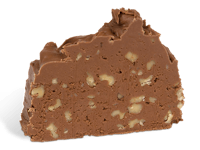 a piece of chocolate fudge on a black background