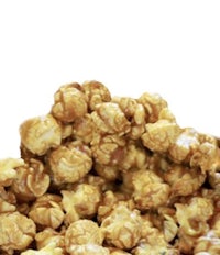 a pile of caramel popcorn on a white background